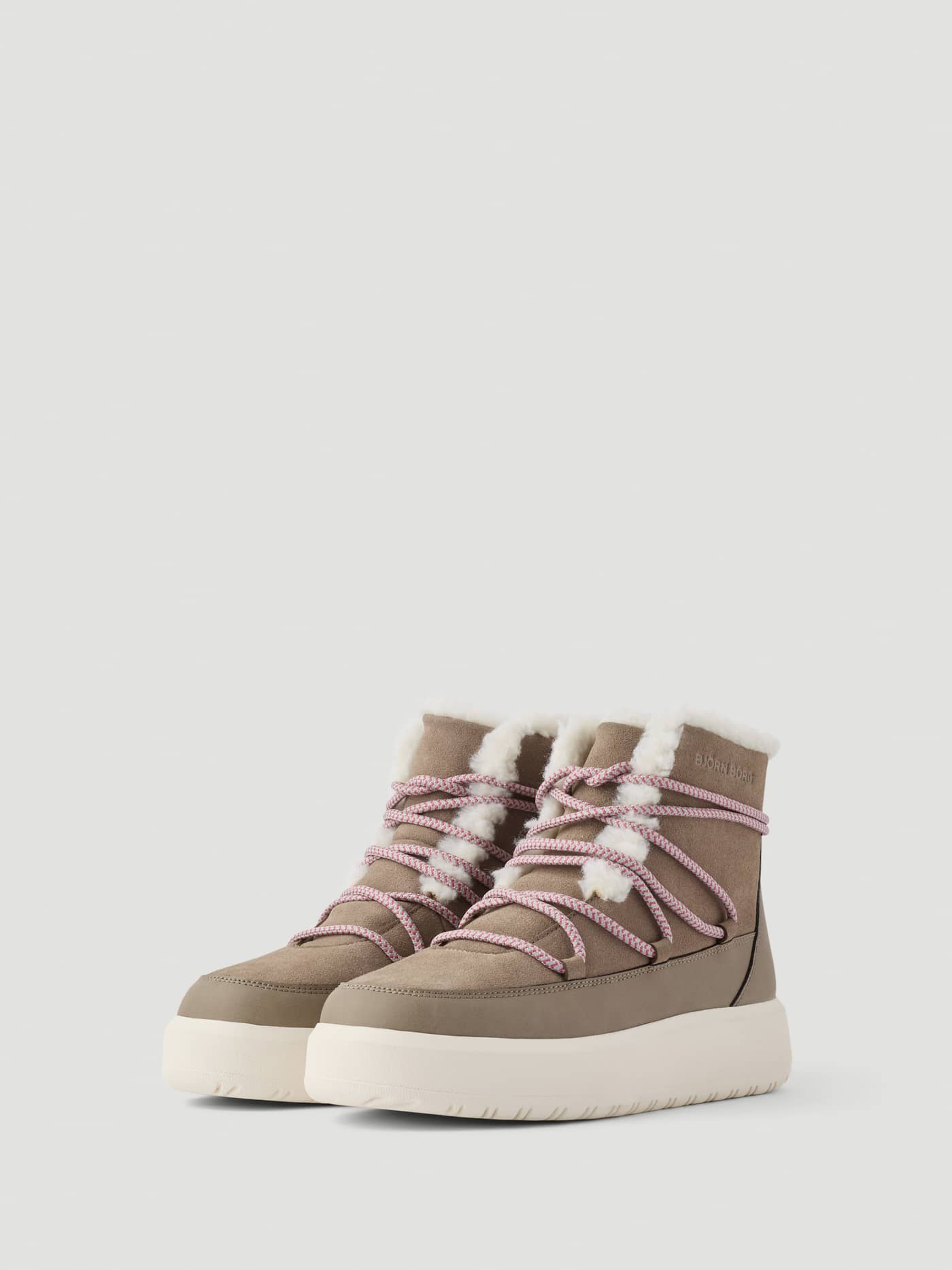 Women's Wooly Lace Up Boots in Brown featuring faux fur lining, pink patterned laces, and a chunky white sole. - Image 2