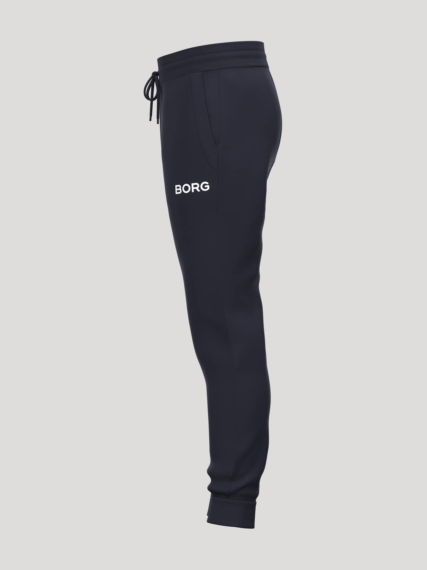 Borg Essential 3 Tapered Sweatpants in Night sky (Navy) seen from the side, featuring a white logo print. - Image 3