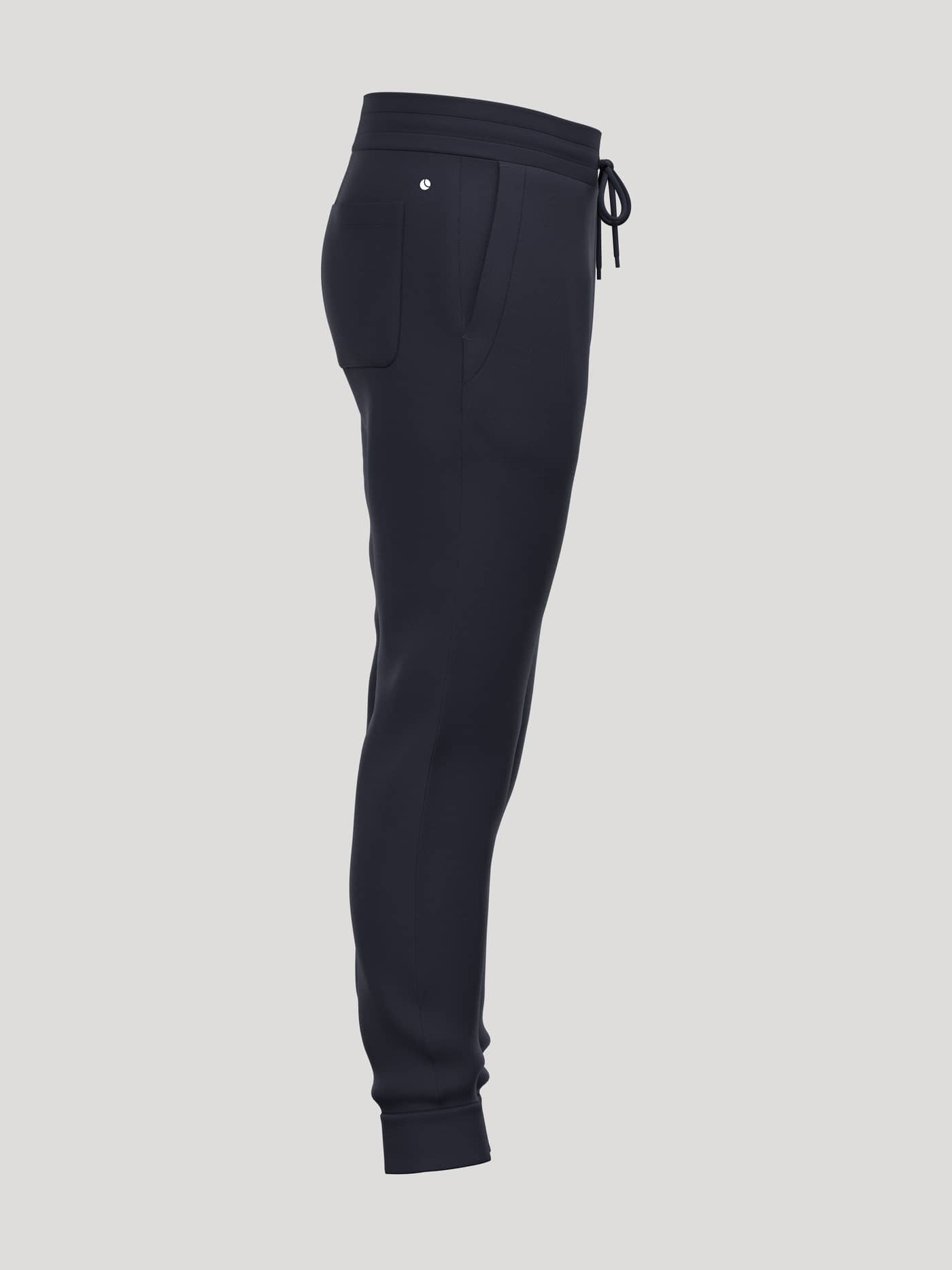 Side view of Borg Essential 3 Tapered Sweatpants in Night sky (Navy) with side pockets and a white tennis ball logo. - Image 4