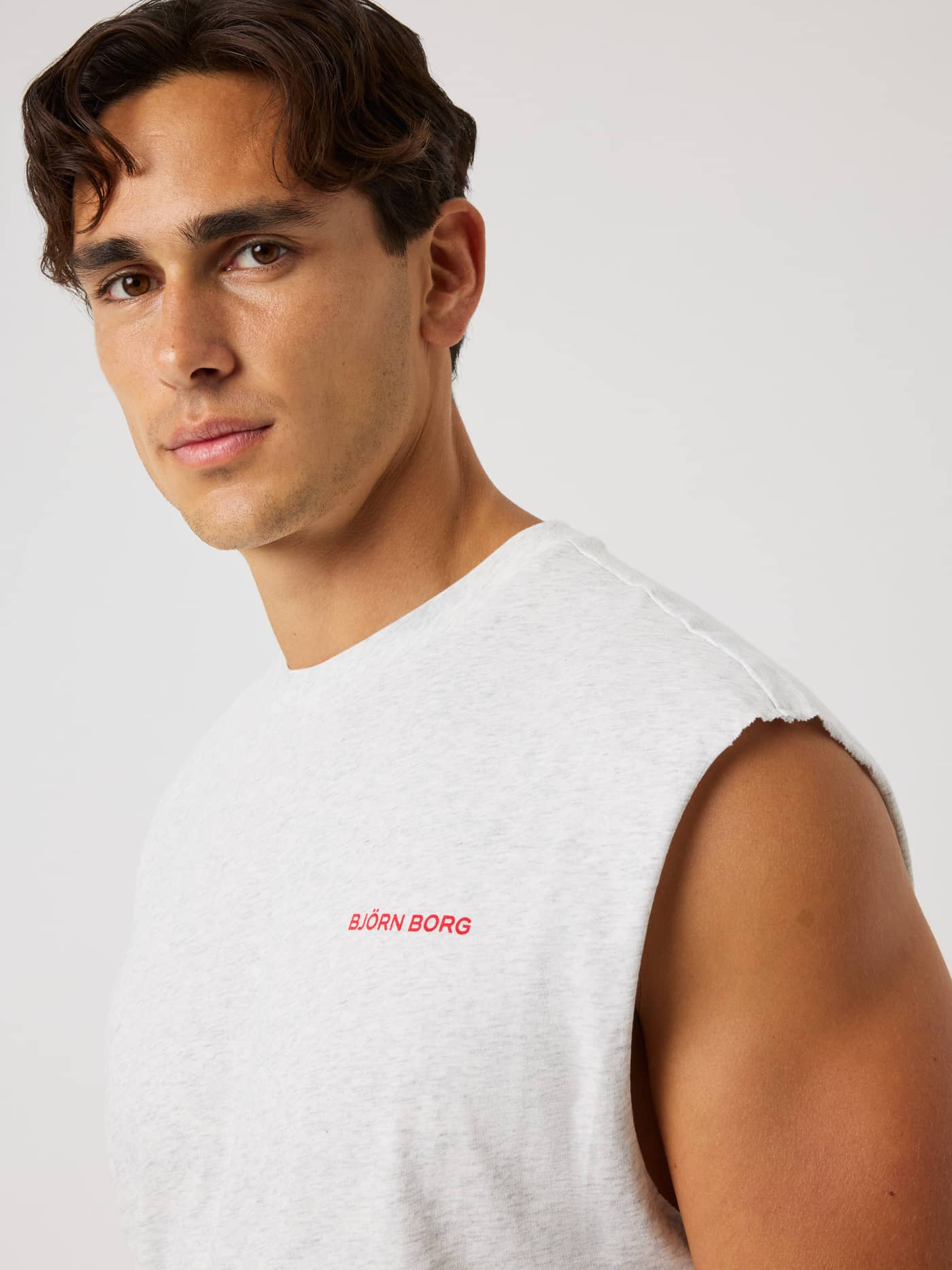 Borg Gym Sleeveless T-Shirt in Ultra Light Grey Melange (Grey) with a red chest logo, ideal for gym training and tennis. - Image 5