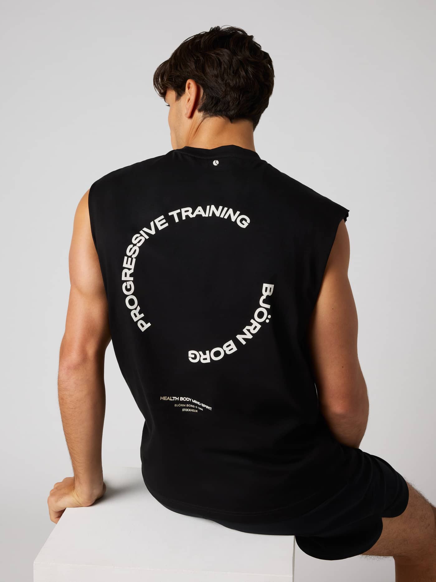 Back view of the Borg Gym Sleeveless T-Shirt in Black Beauty (Black) with white training graphics and a tennis ball print. - Image 5