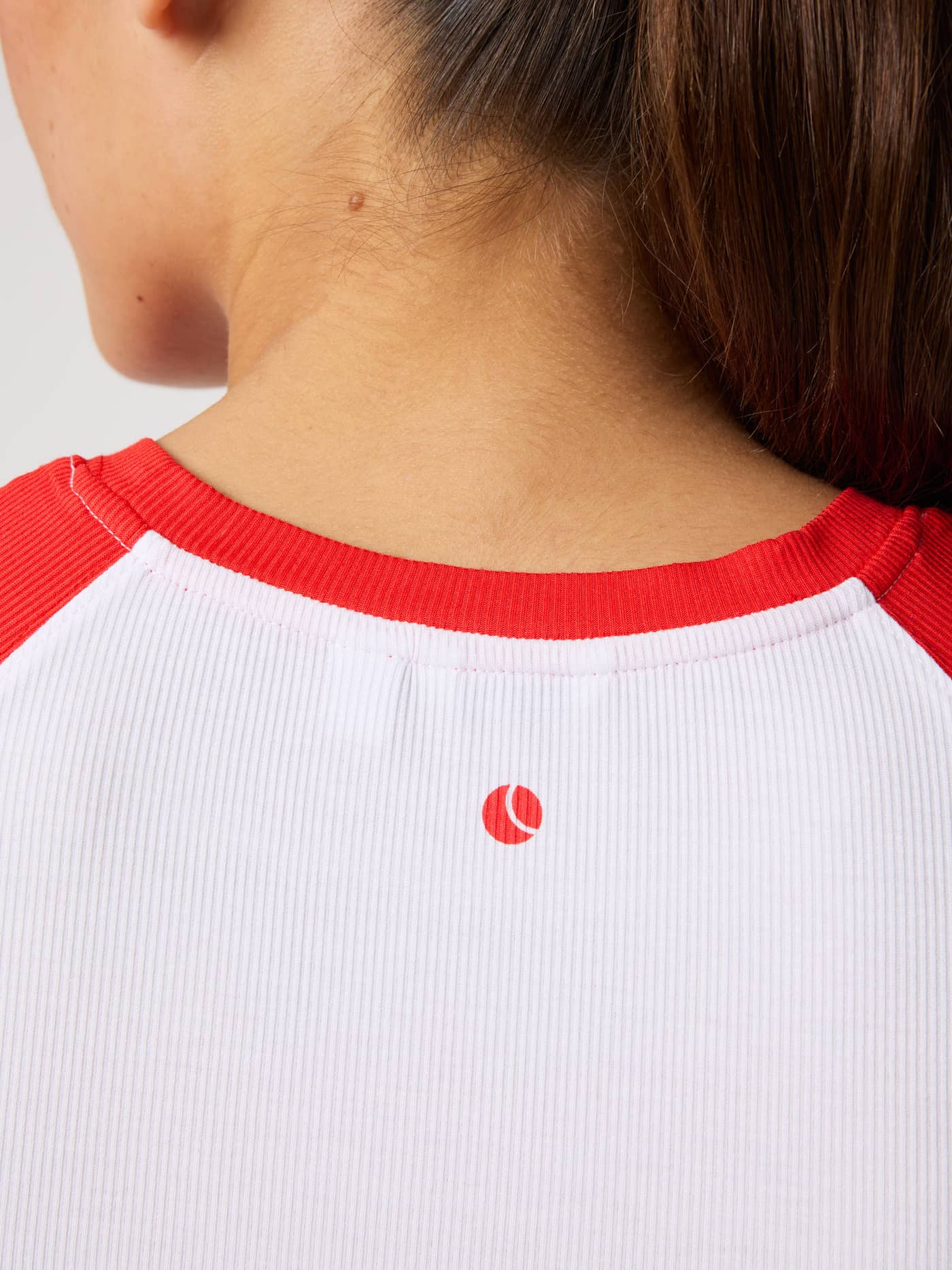 Studio Ringer T-Shirt in Brilliant White (White) featuring ribbed fabric and a red tennis ball print at the back neck. - Image 6