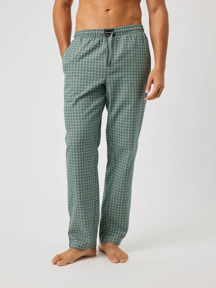 Front view of Core Flannel Pyjama Pants in green, black, and white check with a black logo label at the waist.