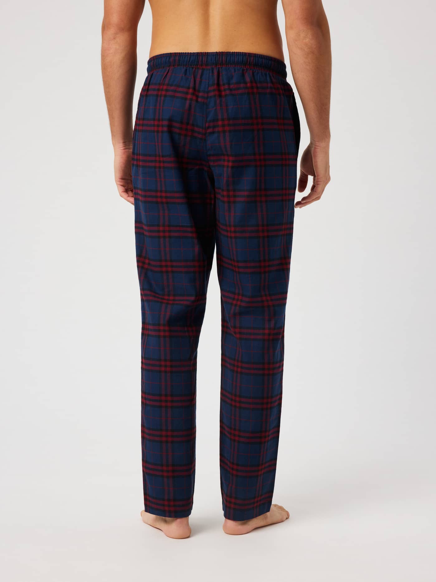 Back view of the Core Flannel Pyjama Pants featuring a blue and red tartan pattern. - Image 2