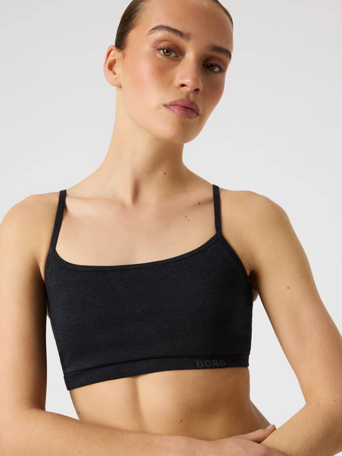 Studio Flow Racerback Bra in Black Beauty (Black) for training, showing a front view with a tonal logo on the band.