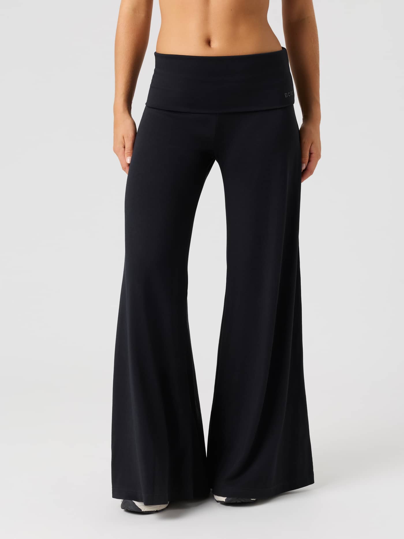 Front view of the Studio Flow Folded Wide Pants in Black Beauty (Black) featuring a wide-leg design and foldable high waist. - Image 3