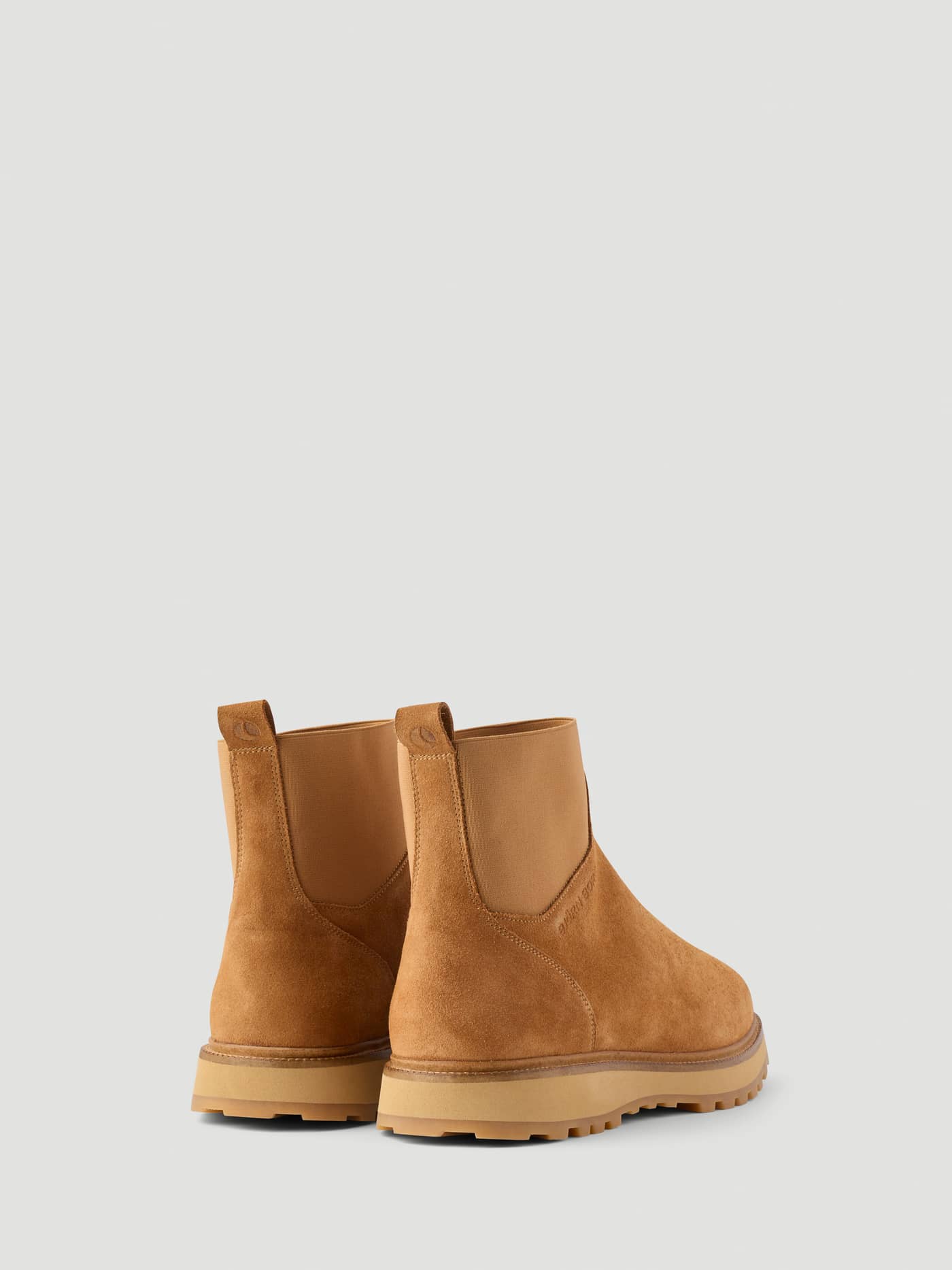 Men's Summit Chelsea Boots in Brown leather, shown from a three-quarter rear view with elastic panels and tonal logos. - Image 3