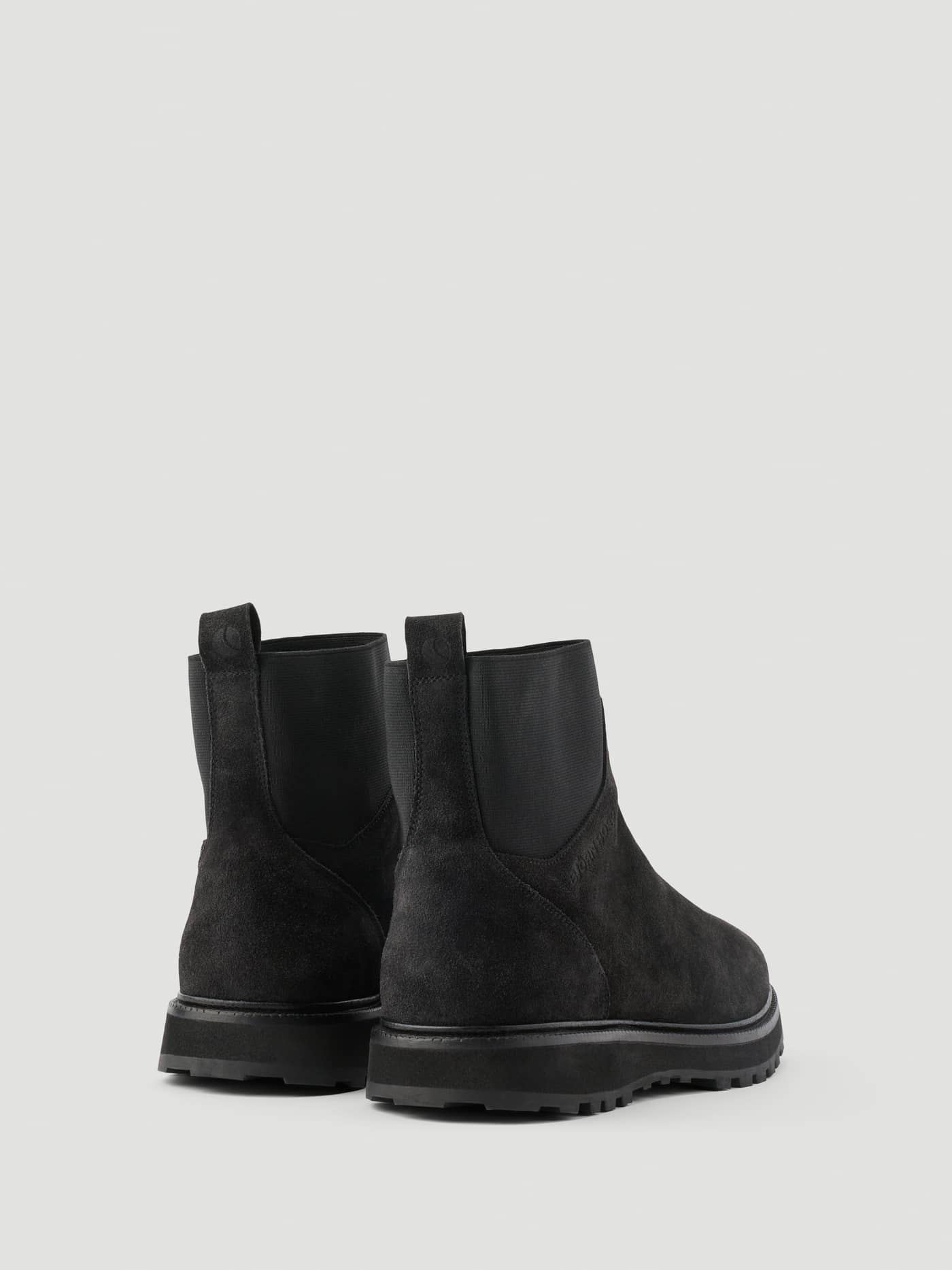 Back view of the Men's Summit Chelsea Boots in Black, featuring premium leather and a durable lugged sole. - Image 3