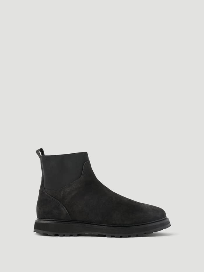 Men's Summit Chelsea Boots in Black featuring a premium leather finish, elastic side panels, and a chunky rubber sole.