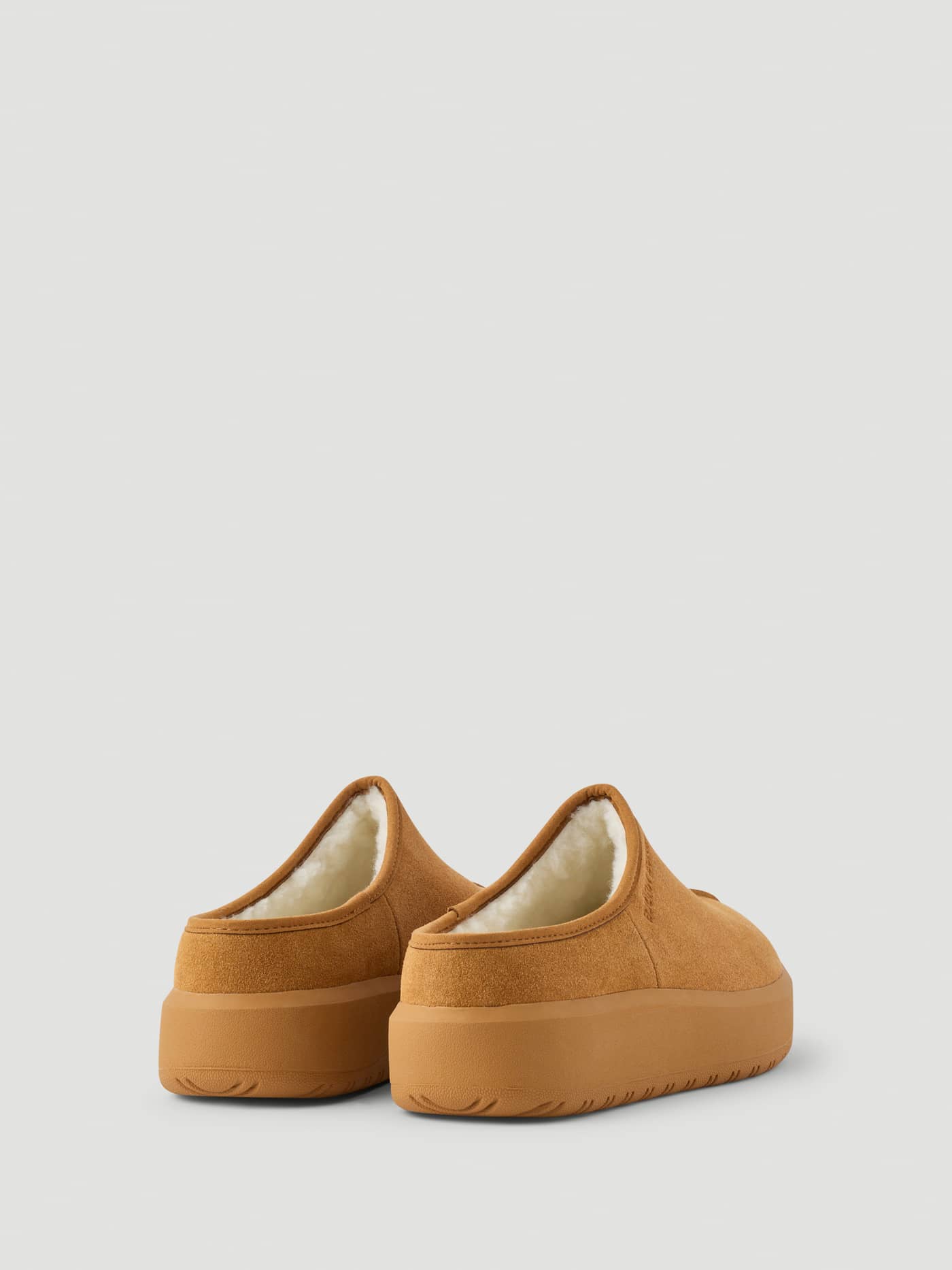 Back view of the Women's Wooly Clog Boots in Brown with a chunky platform sole, plush wooly lining, and tonal logo. - Image 3
