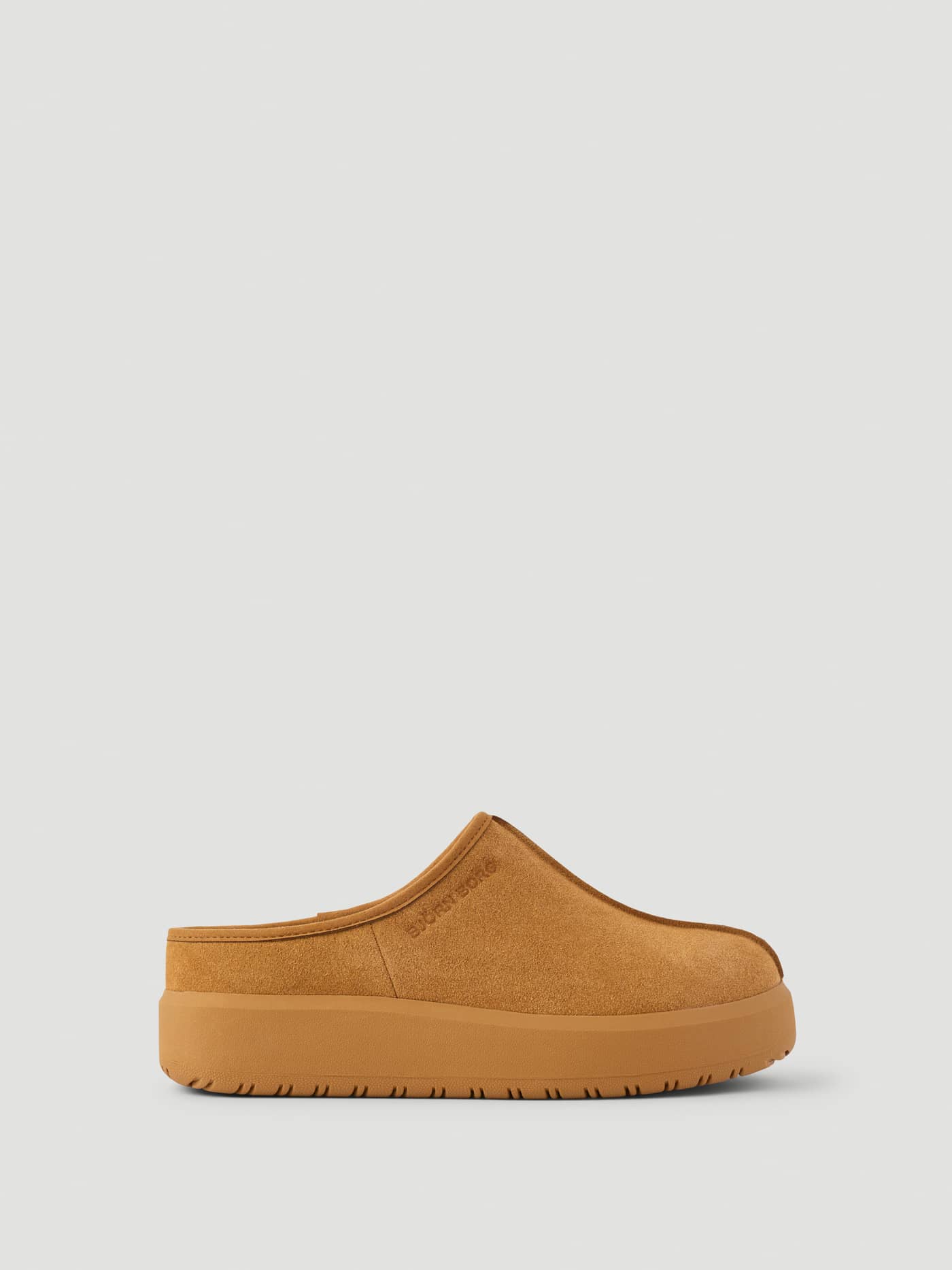 Side view of the Women's Wooly Clog Boots in Brown with an embossed logo and elevated platform sole. - Image 1