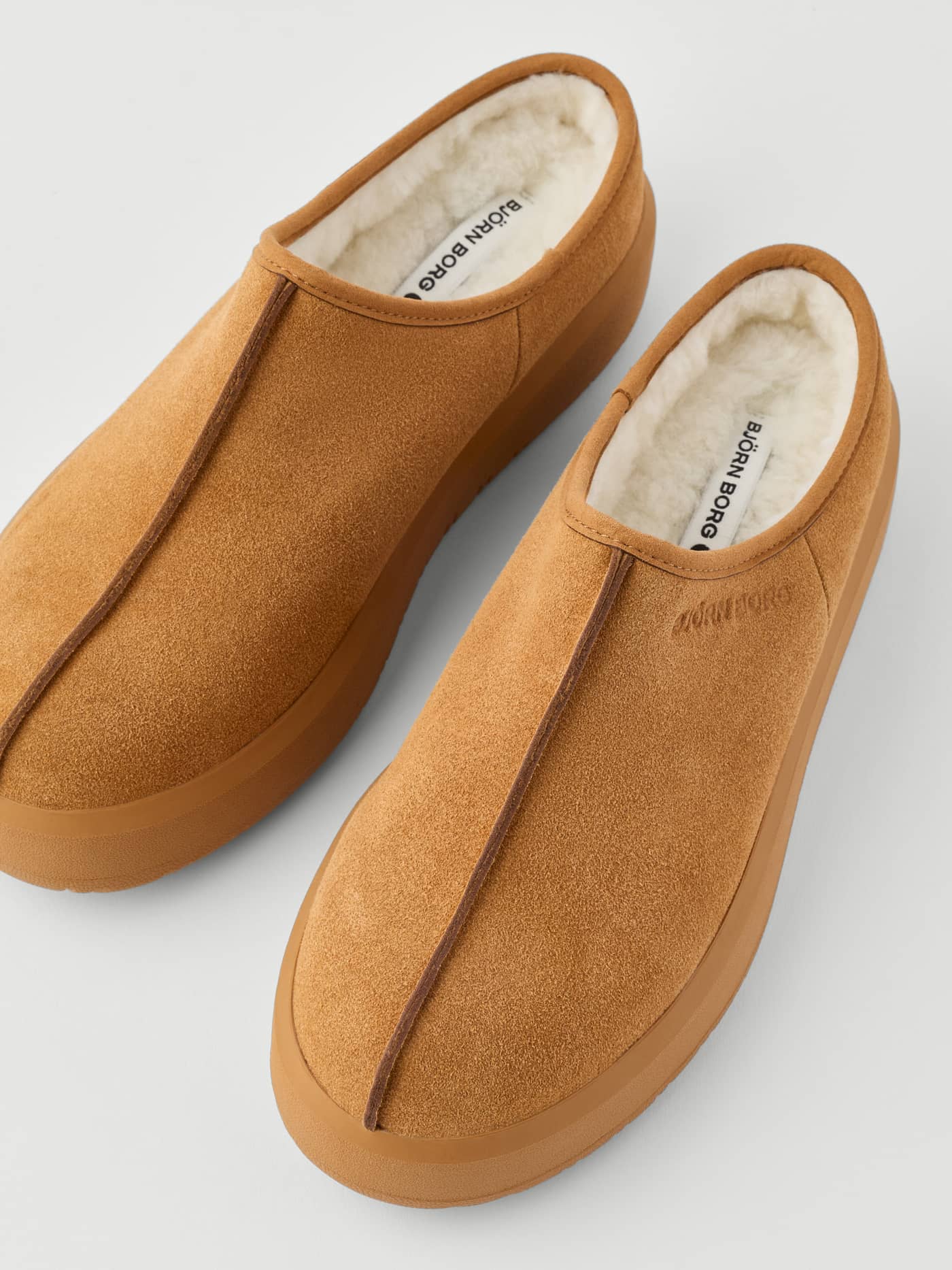 Women's Wooly Clog Boots in Brown featuring a soft suede finish, cozy white wool lining, and a chunky platform sole. - Image 4