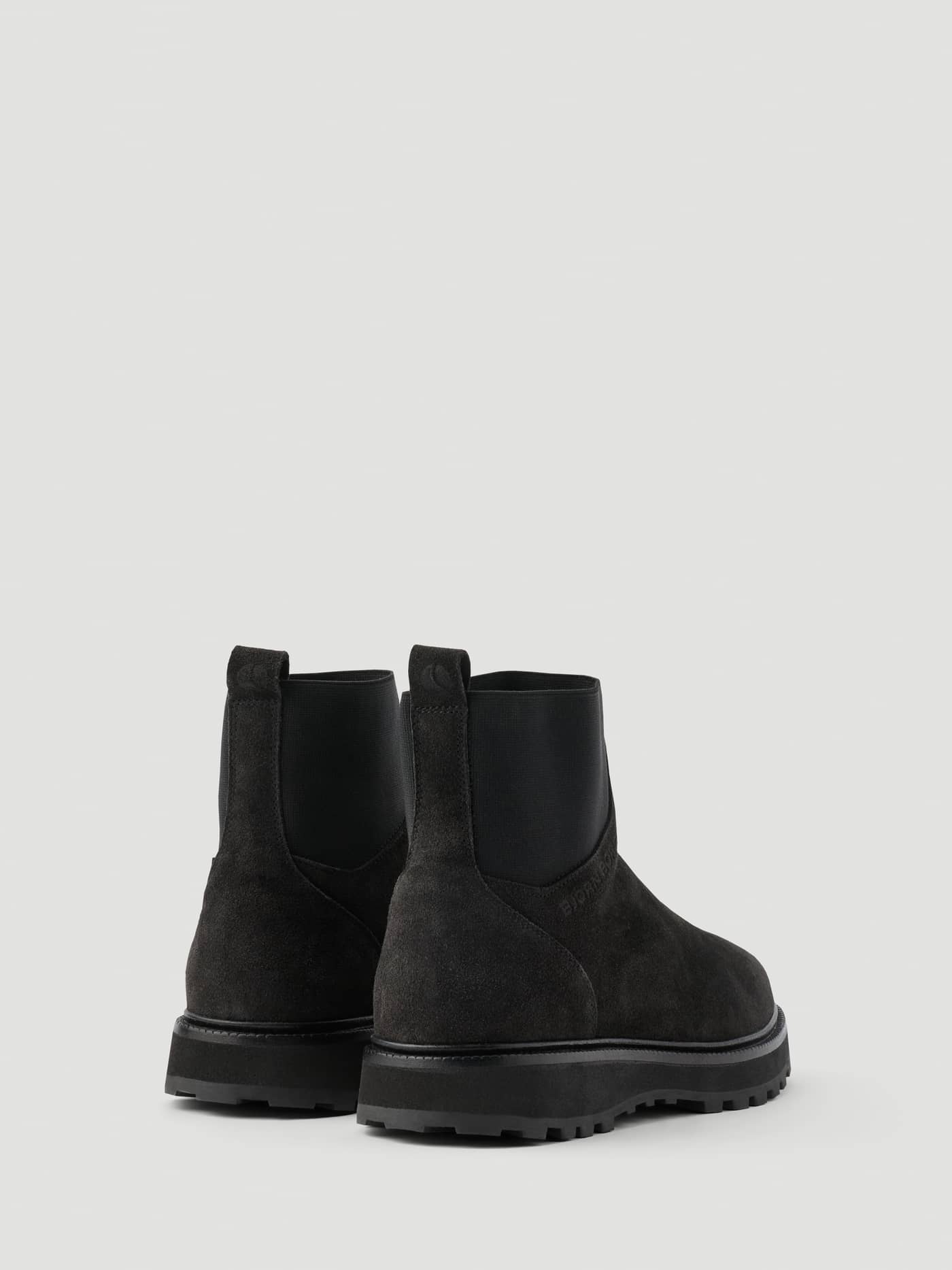 Back view of the Women's Summit Chelsea Boots in Black featuring a premium leather finish and durable chunky sole. - Image 3
