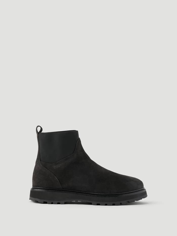Side view of Women's Summit Chelsea Boots in Black, crafted from premium leather with elastic panels and a lug sole.