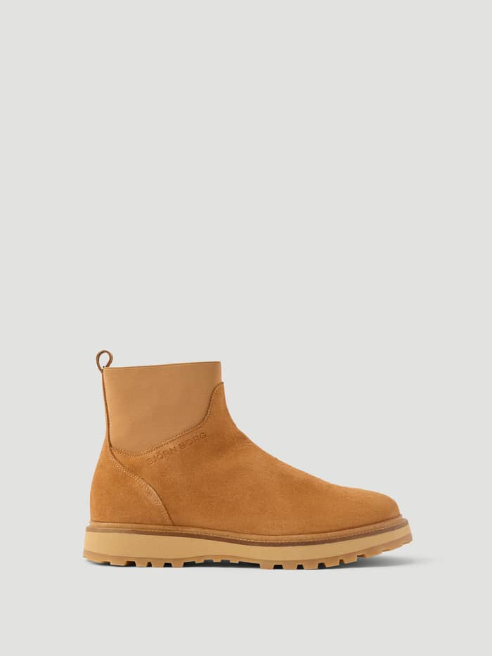 Women's Summit Chelsea Boots in Brown leather featuring a chunky lug sole, heel pull tab, and a tonal embossed logo.