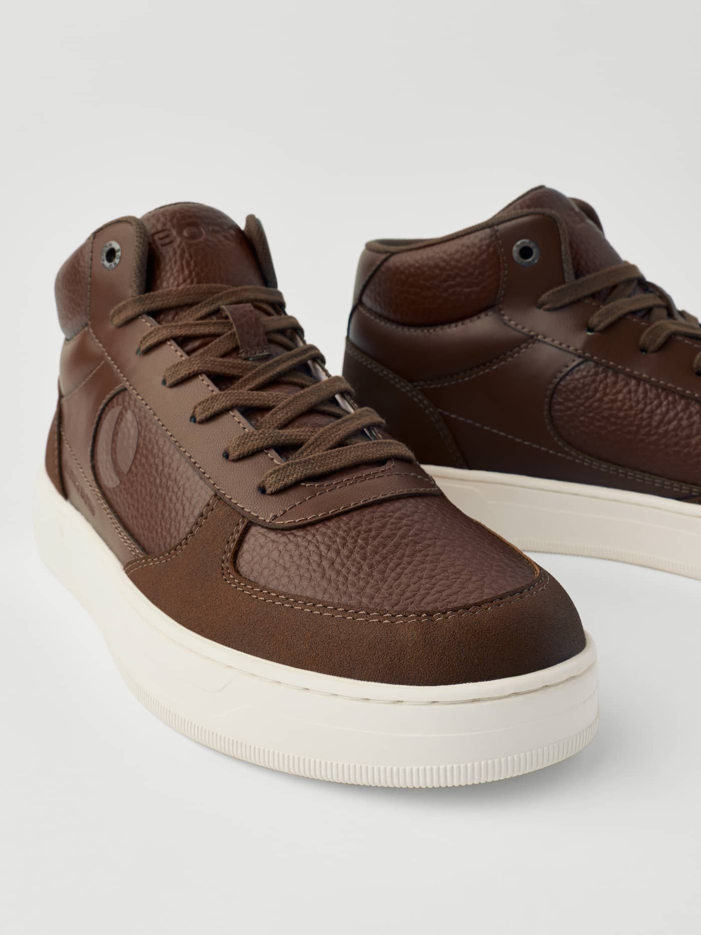 Men's Challenger Mid Sneakers in Brown feature a tennis-inspired mid-top design and textured synthetic leather. - Image 4