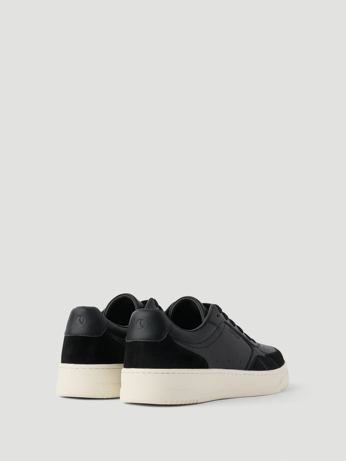 Back view of Men's Victory Leather Sneakers in Black, featuring premium leather and suede with a tennis-inspired design. - Image 3