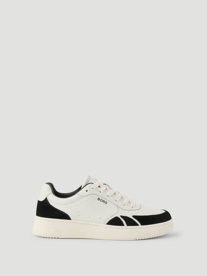 Women's Victory Leather Sneakers i vitt och svart med en svart logo och tennisinspirerad design i läder och mocka.