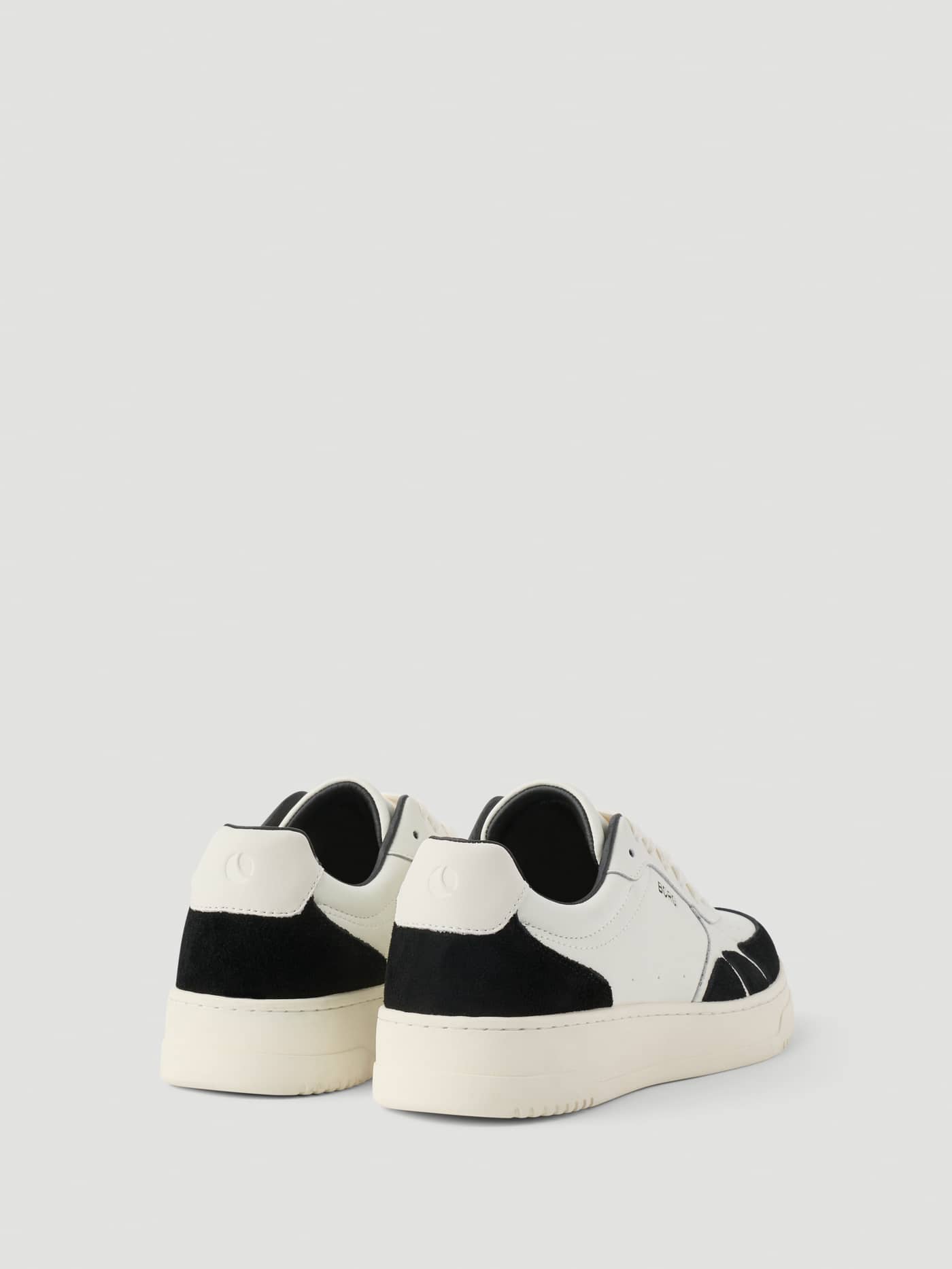 Rear view of Women's Victory Leather Sneakers in White and Black, showing a tennis-inspired style and a white heel logo. - Image 3