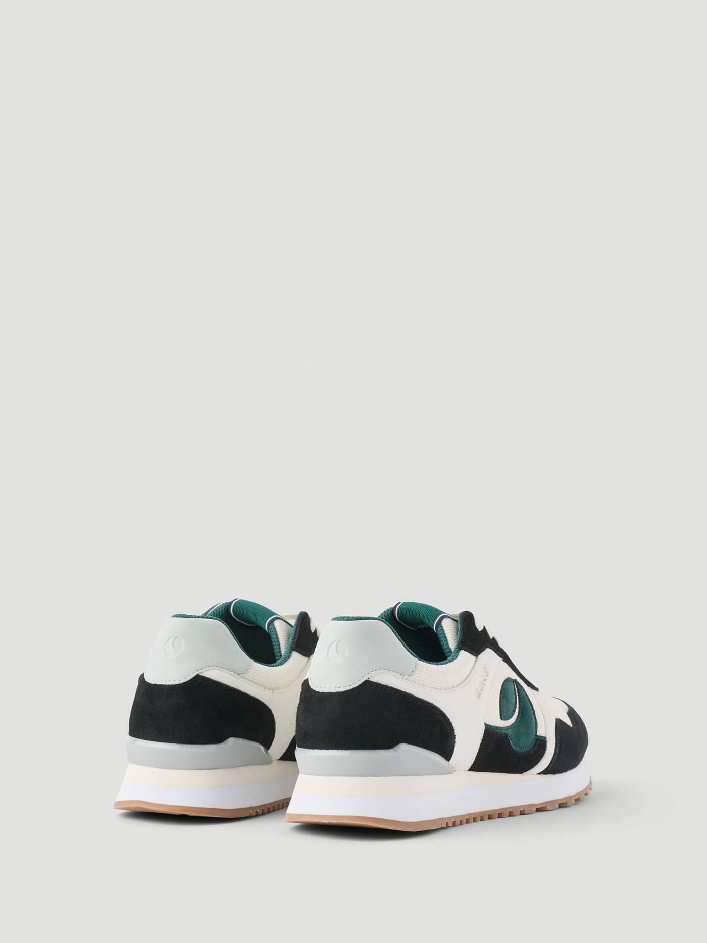 Back view of Men's Pulse Sneakers in black and green with suede and polyester details, featuring a green logo for running. - Image 4