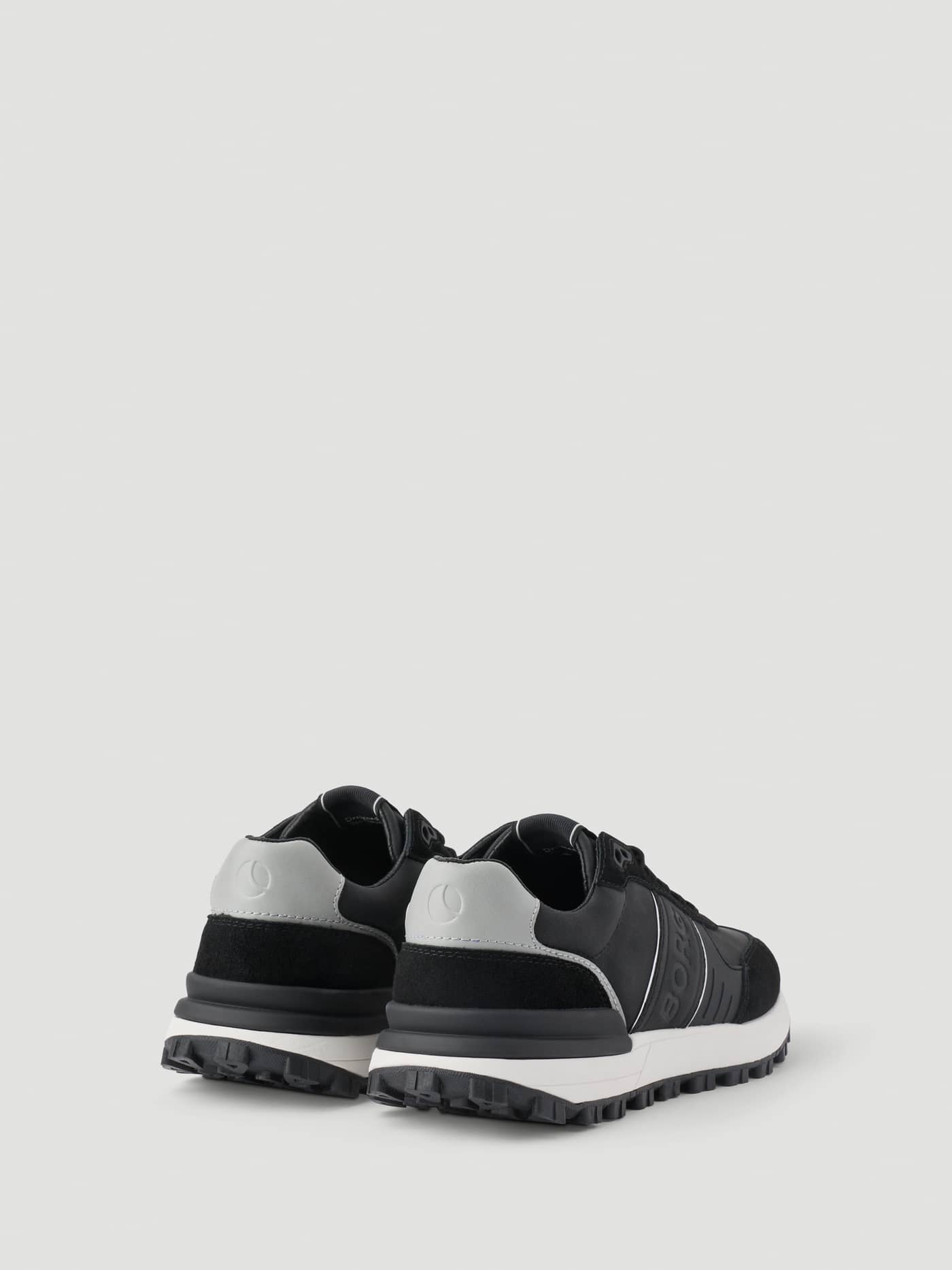 Back view of Men's Pace Nu Sneakers in Black featuring technical running details, white soles, and a grey heel logo. - Image 3