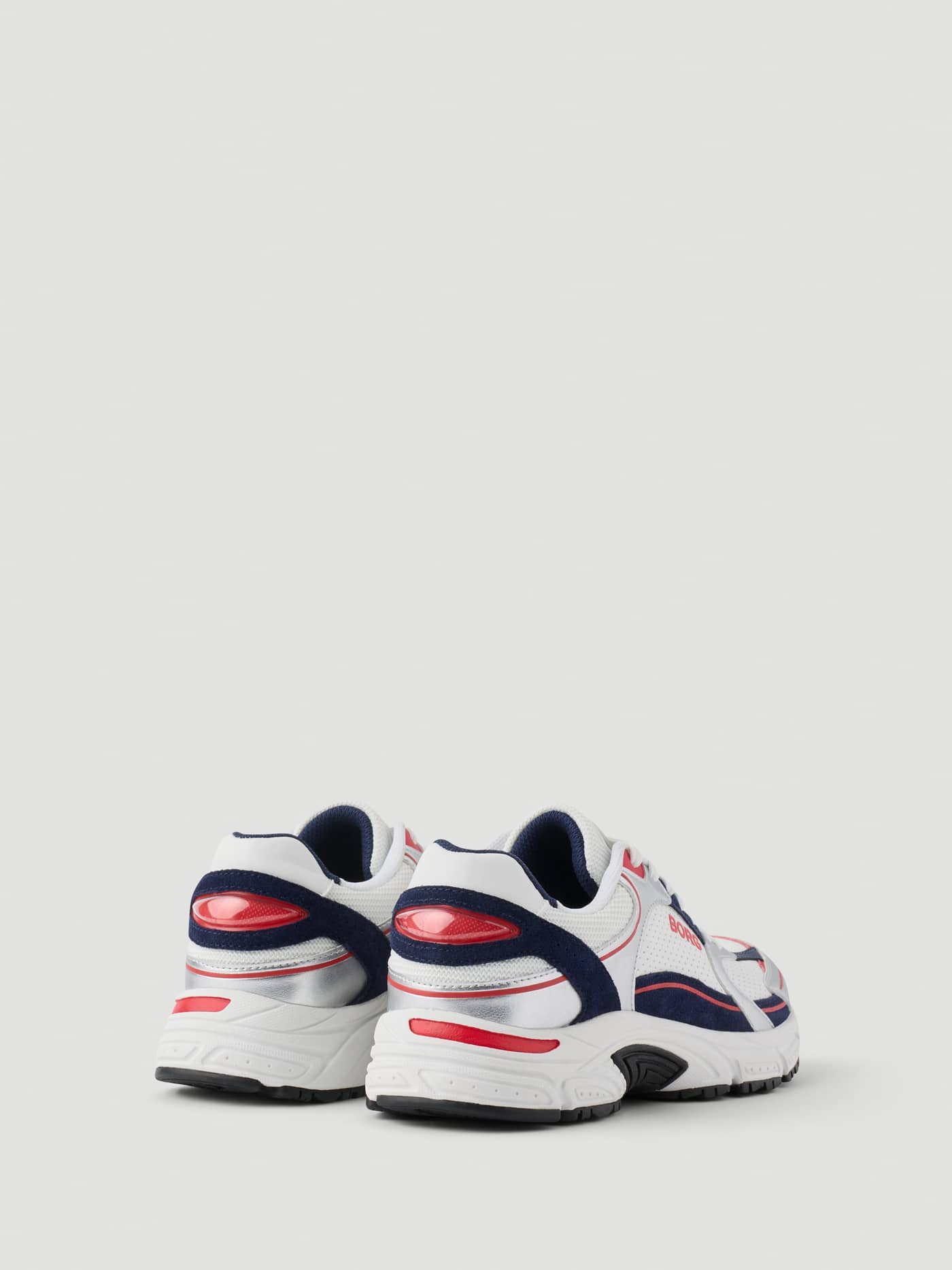 Women's Alley Sneakers in White and Navy with red logo accents, featuring a back view for a running lifestyle. - Image 4