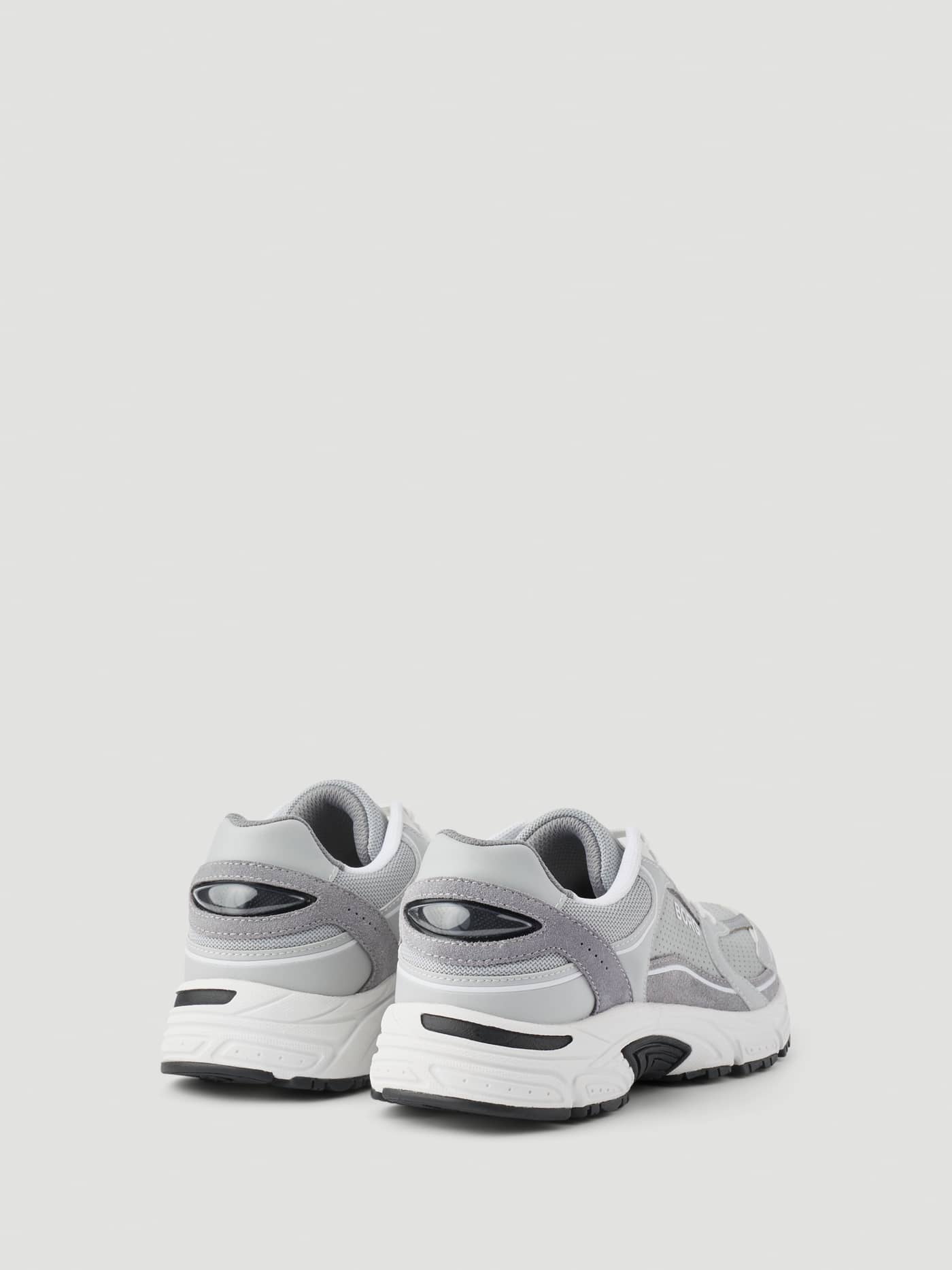 Back view of the Women's Alley Sneakers in Grey and White, featuring a running-inspired design and white logo details. - Image 4