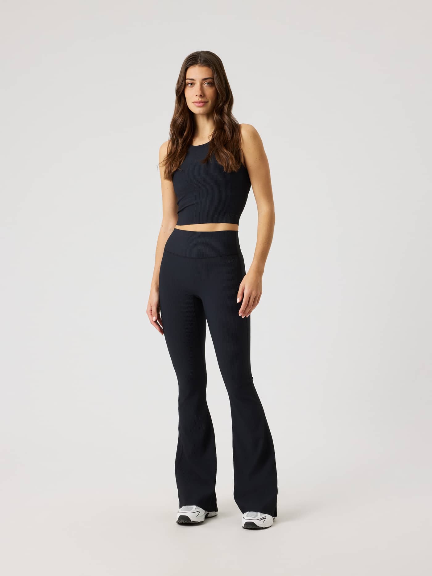 Front view of a model in Studio Ribbed Flare Tights Tall in Black Beauty (Black), ideal for studio training. - Image 3