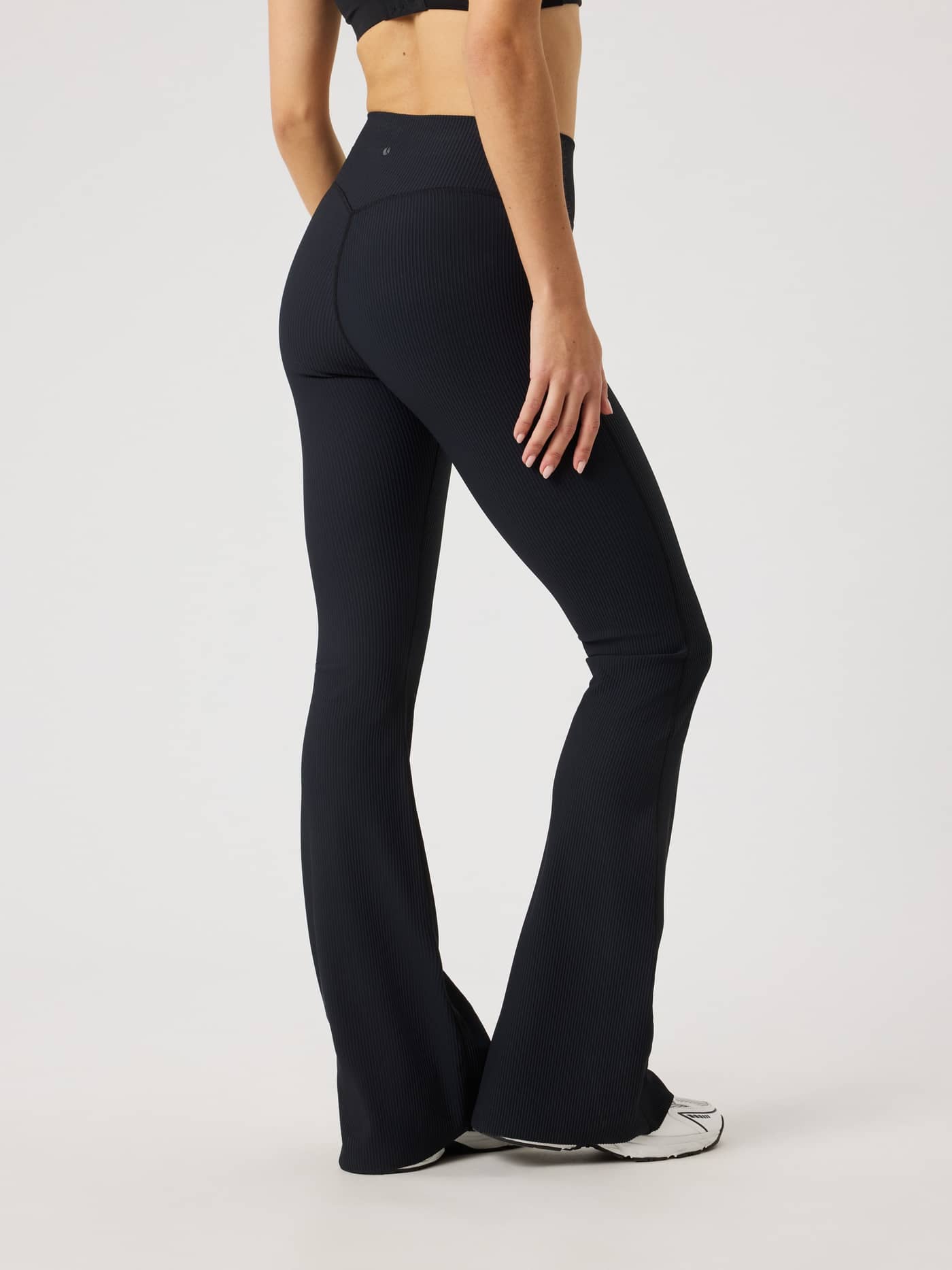 Studio Ribbed Flare Tights Tall in Black Beauty (Black) featuring a flared leg and ribbed texture for training. - Image 2