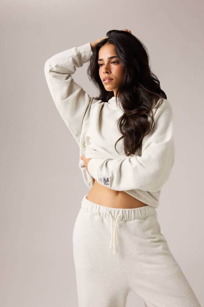 Studio French Terry Oversized Hoodie in Tofu Melange (Beige) on a model, featuring an oversized fit for studio warm-ups.