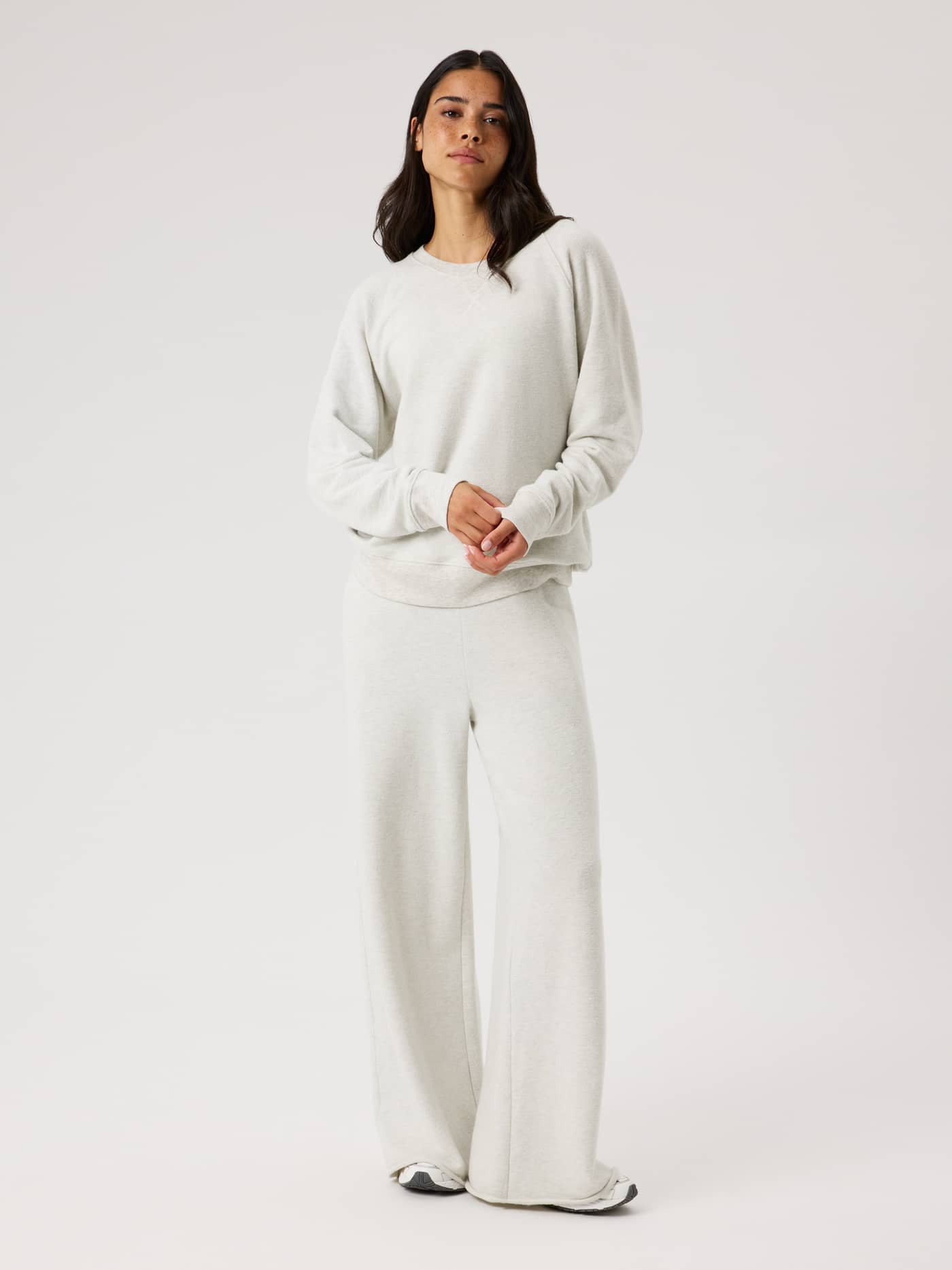 Full-body front view of the Studio French Terry Oversized Sweatshirt in Tofu Melange (Beige) for a relaxed studio style. - Image 3