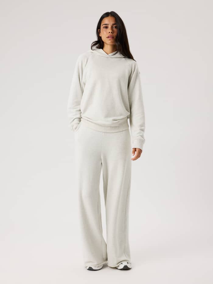 Full-body front view of a model in Studio French Terry Oversized Sweatpants in Tofu Melange (Beige) for studio movement.