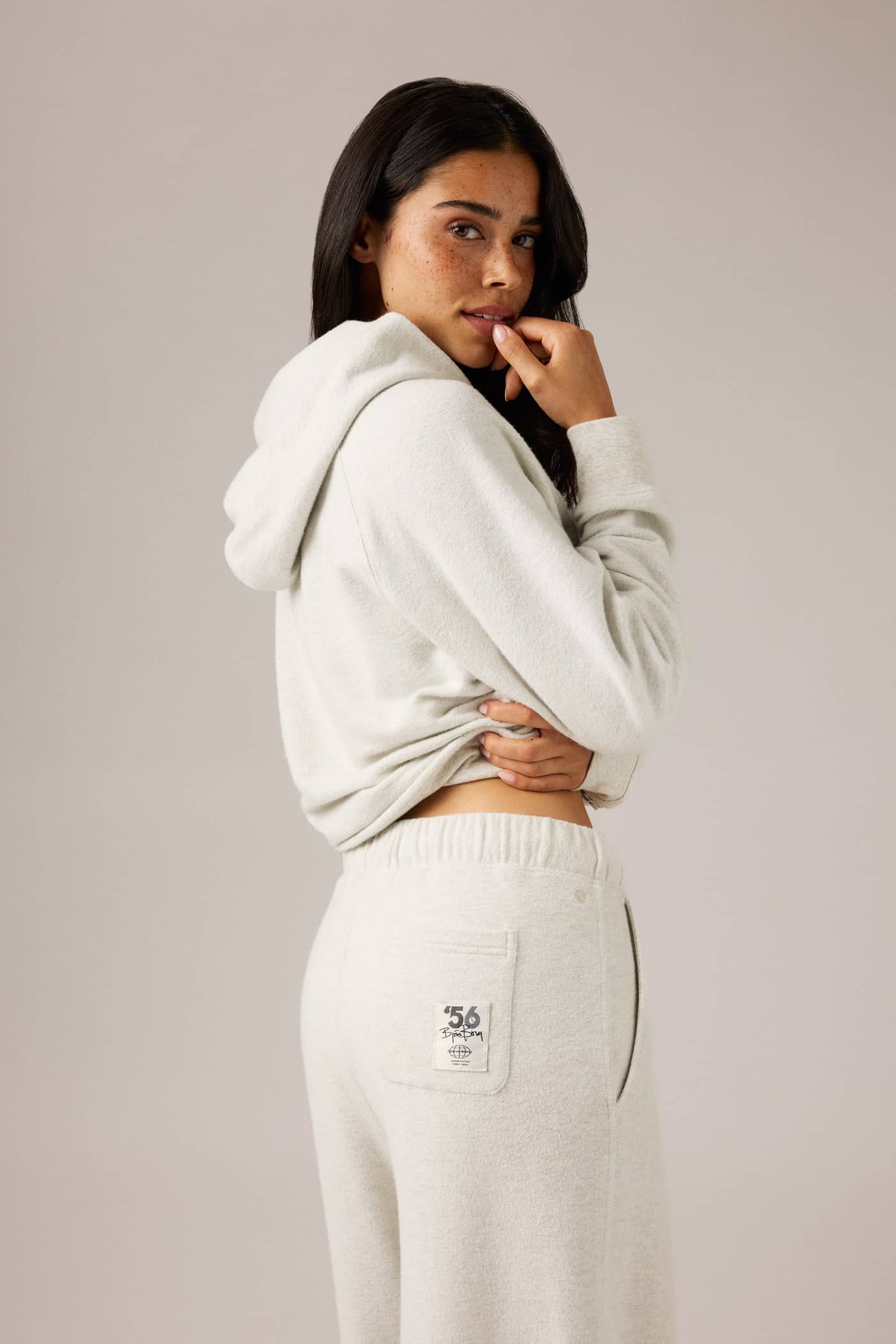 Studio French Terry Oversized Sweatpants in Tofu Melange (Beige) featuring a heritage logo patch on the pocket. - Image 4