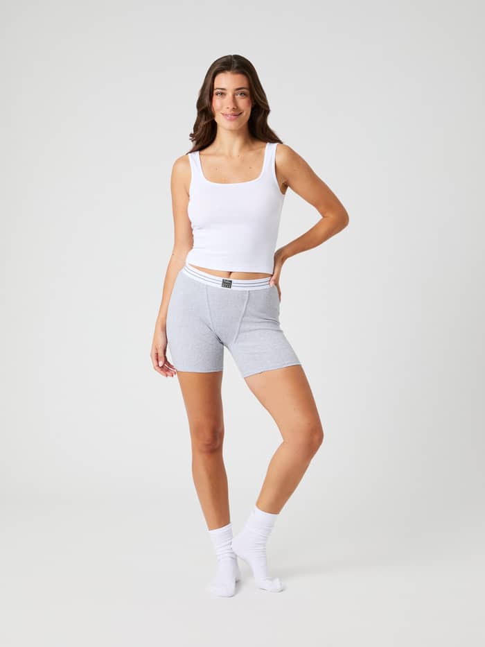 Front view of a model wearing Core Original Rib Boxer Briefs in Light Grey Melange (Grey) with a white elastic waistband. - Image 4