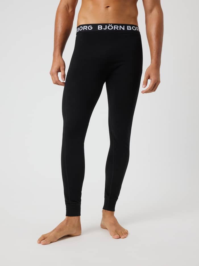 Front view of a model wearing the Bamboo Cotton Blend Long John 1-pack in Black with a white logo waistband.