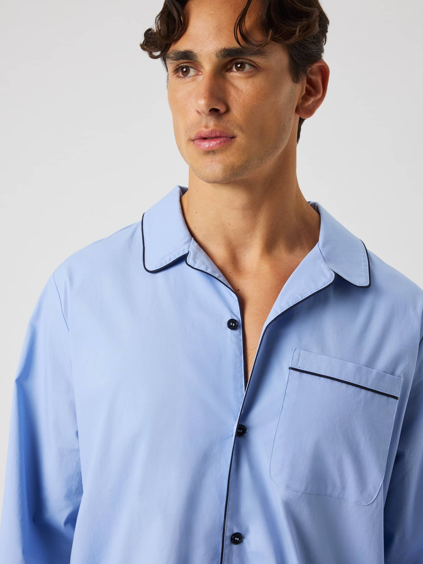 Close-up of the Core Premium Pyjama Shirt in Lavender Lustre (Blue) featuring a chest pocket and piped details. - Image 4