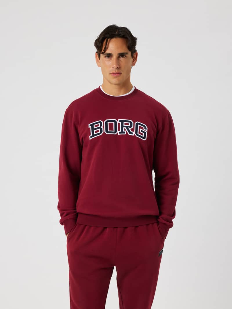 Front view of the Borg Classic Print Sweatshirt in cabernet (red) featuring a white and navy BORG logo across the chest.