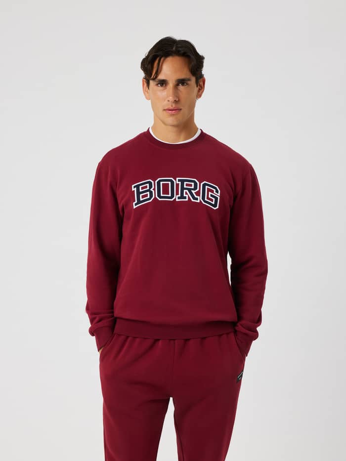 Front view of the Borg Classic Print Sweatshirt in cabernet (red) featuring a white and navy BORG logo across the chest.