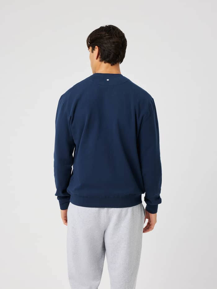 Back view of the Borg Classic Print Sweatshirt in Dress Blues (Navy) worn by a model.