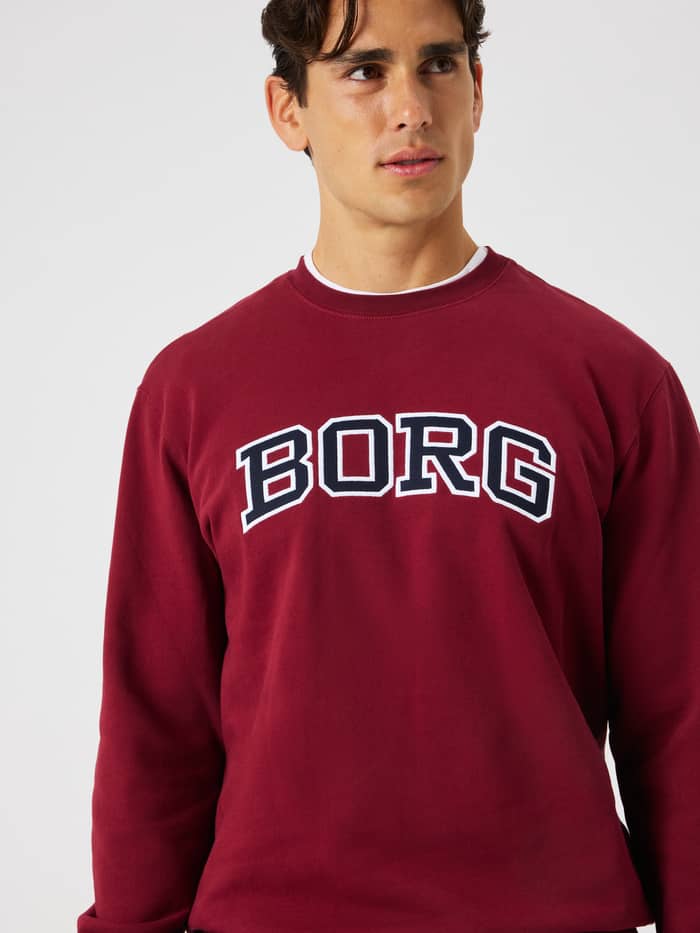 Close-up of the Borg Classic Print Sweatshirt in Cabernet featuring a white and black BORG logo across the chest.