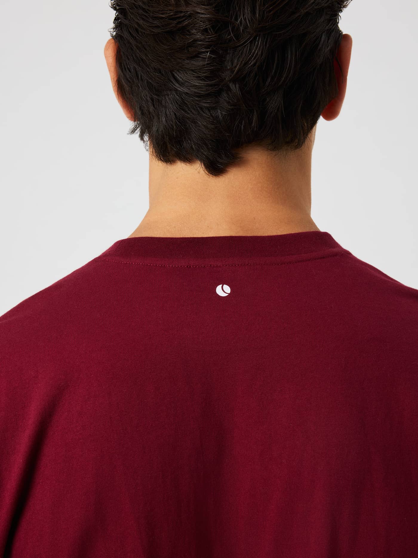 Back view of the Borg Classic Print T-Shirt in Cabernet (red) featuring a small white logo detail at the neckline. - Image 5