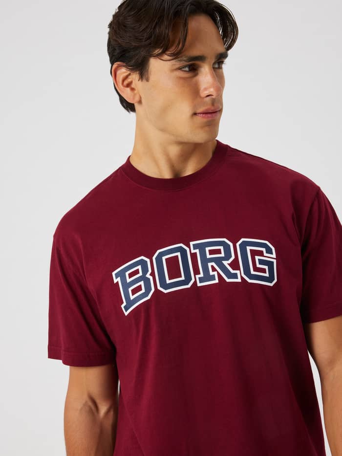 Close-up of the Borg Classic Print T-Shirt in Cabernet (red) highlighting the arched BORG logo across the chest.