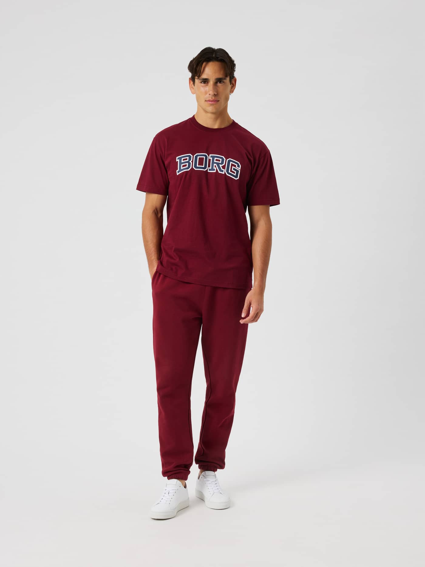 Male model wearing the Borg Classic Print T-Shirt in Cabernet (Red) with a collegiate BORG logo on the chest. - Image 3