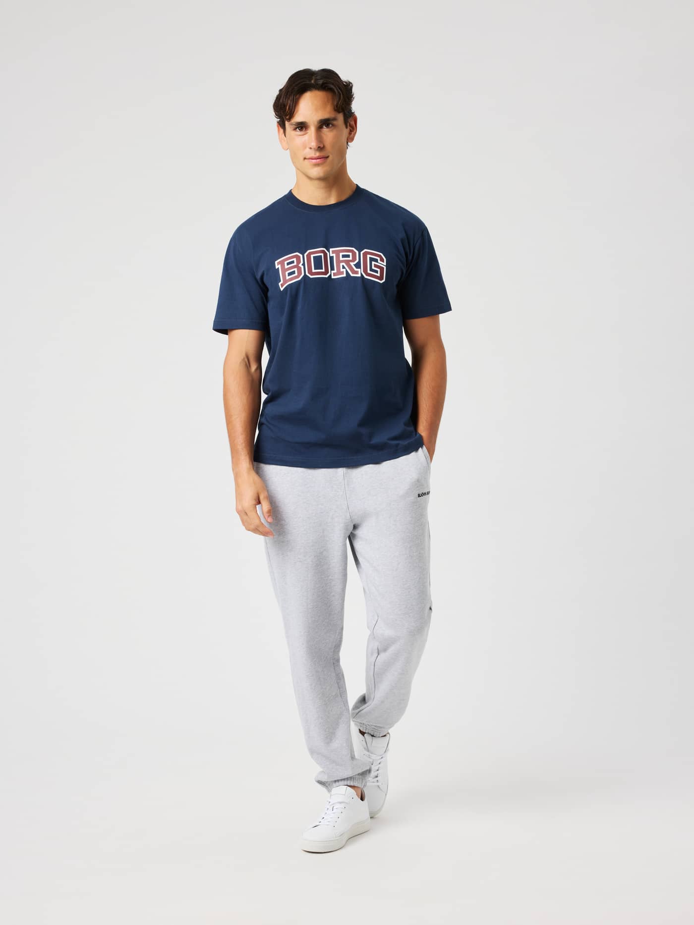 Man wearing the Borg Classic Print T-Shirt in Dress Blues (Navy) featuring a collegiate BORG logo on the chest. - Image 4
