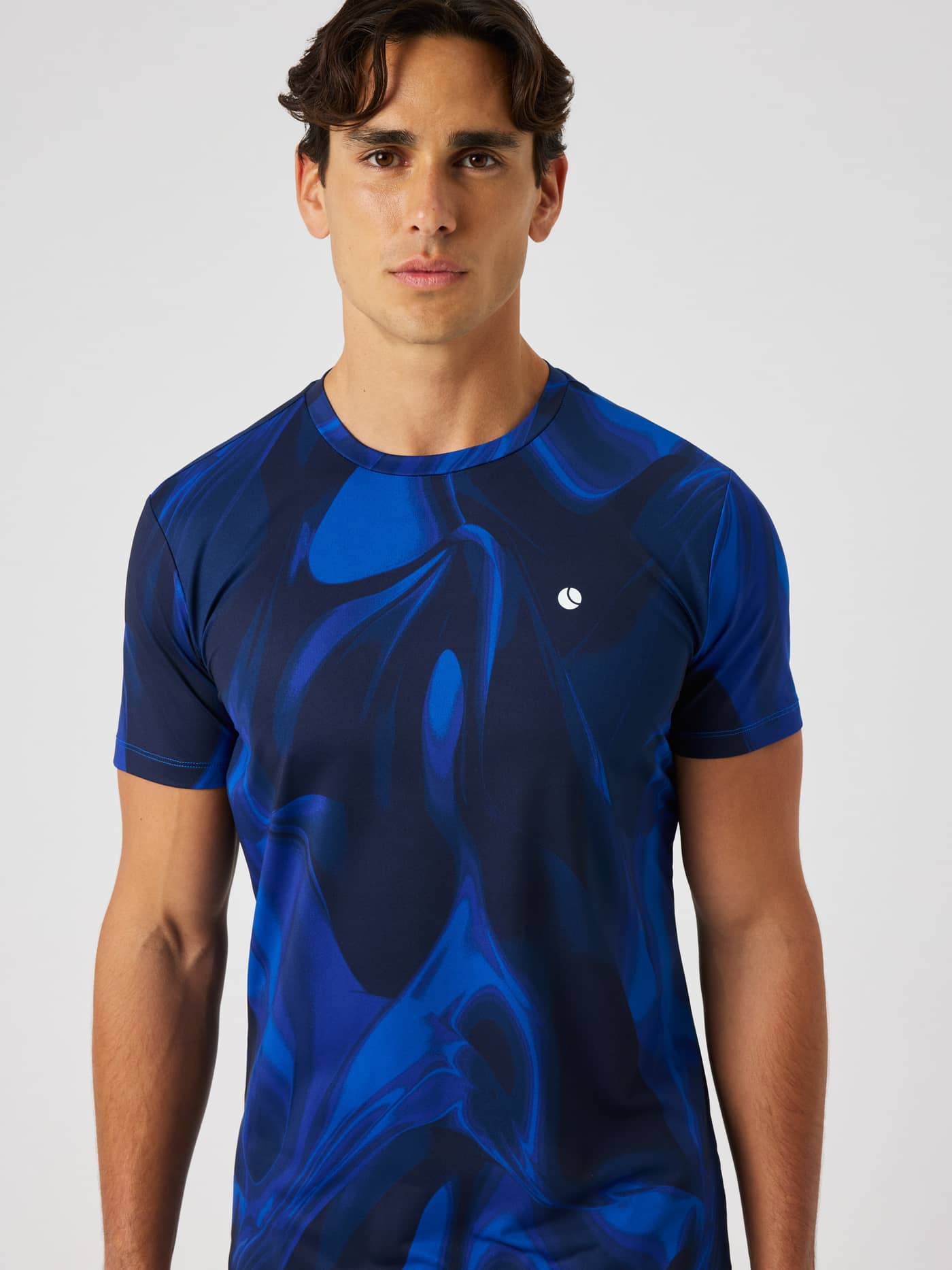 Ace Printed T-Shirt in blue with a wave pattern and a white logo for tennis. - Image 4