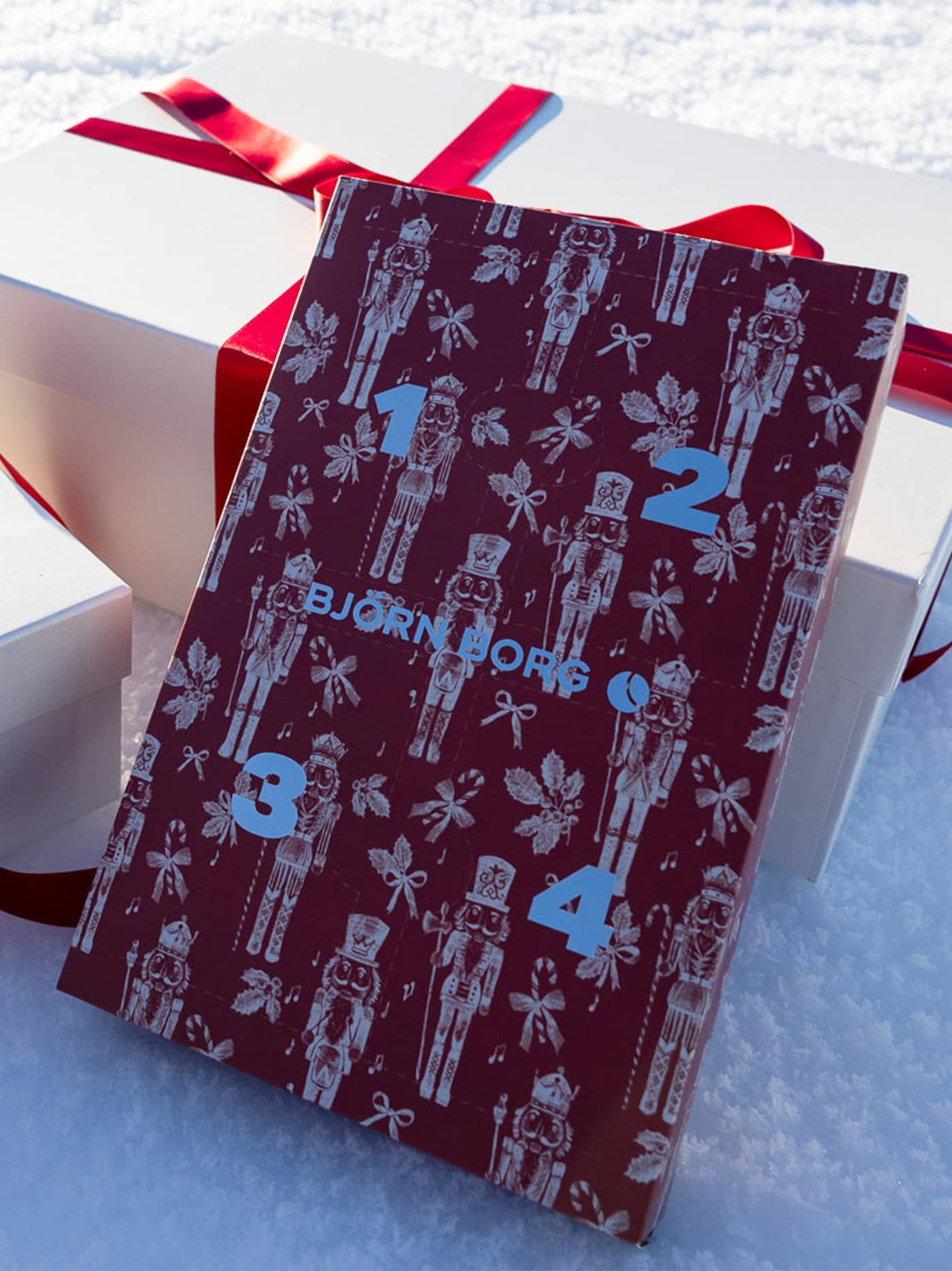 The Cotton Stretch Discovery Box Boxers 4-pack gift box featuring a festive print and numbered Advent design. - Image 1