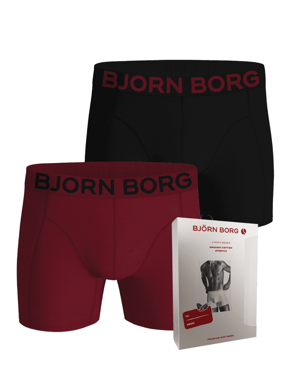 Organic Cotton Stretch Boxer Briefs 2-pack in black and red alongside their holiday packaging. - Image 1