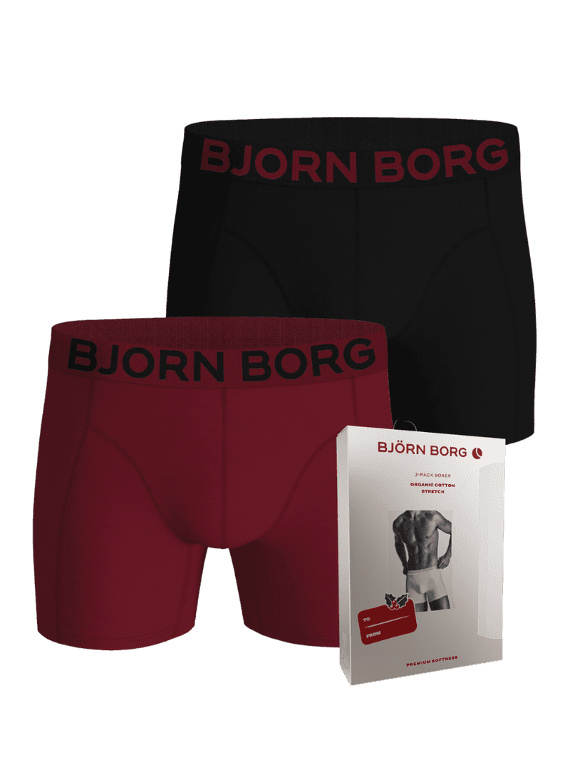 Organic Cotton Stretch Boxer Briefs 2-pack in black and red alongside their holiday packaging.