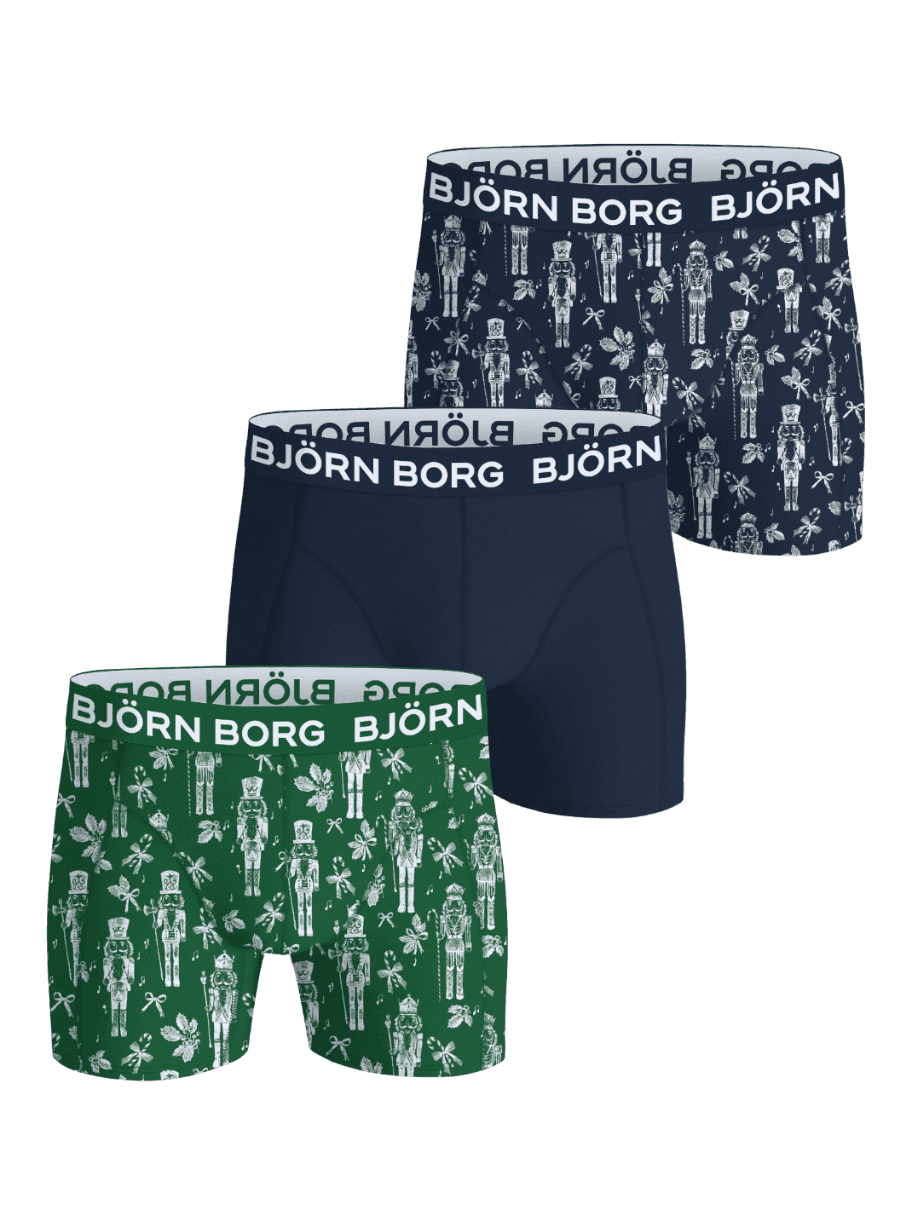 Front view of the Cotton Stretch Boxers 3-pack featuring green, navy, and nutcracker pattern designs with white waistbands. - Image 1