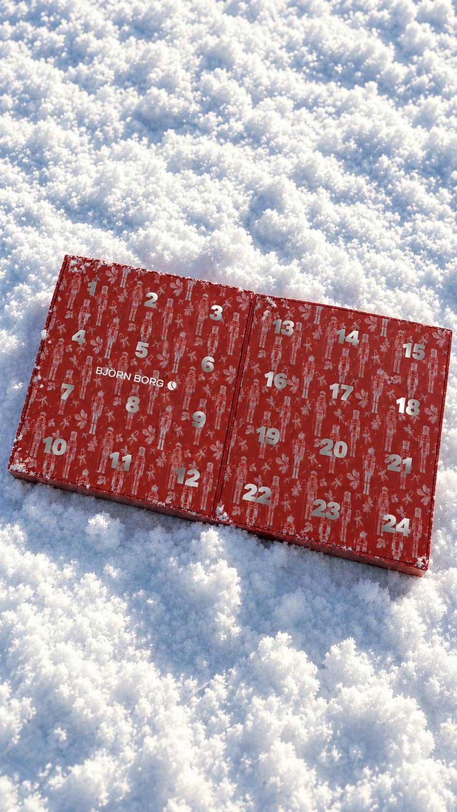 Cotton Stretch Christmas Calender Boxers 24-pack advent calendar in red placed on snow. - Image 1